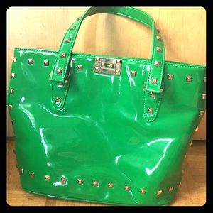 Green purse with silver studs zip top
